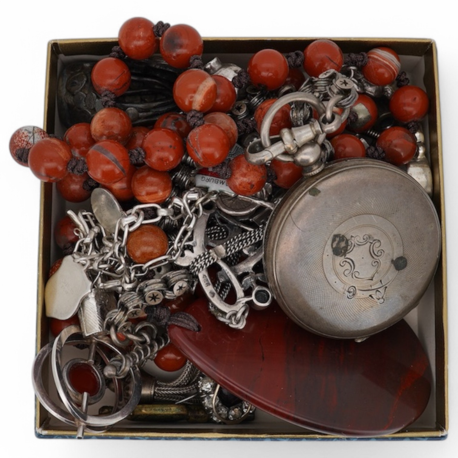 A mixed group of silver jewellery, including two charm bracelets, an Art Nouveau-style pendant; a pocket watch on chain; a pair of moonstone earrings; an onyx and marcasite pendant; a cross pendant; a carnelian pendant;